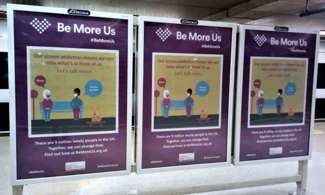 Advert hoarding for a charity. Says Be more us. Let's talk more.